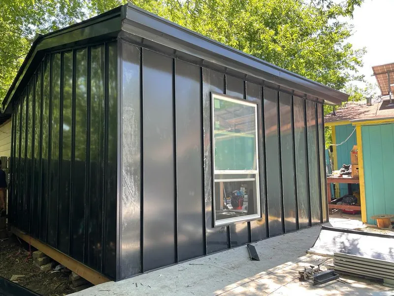 Black standing seam metal wall panels for Metal Roof Installation in Dunedin